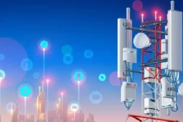 a tower with many antennas and lights- New Telecom Act