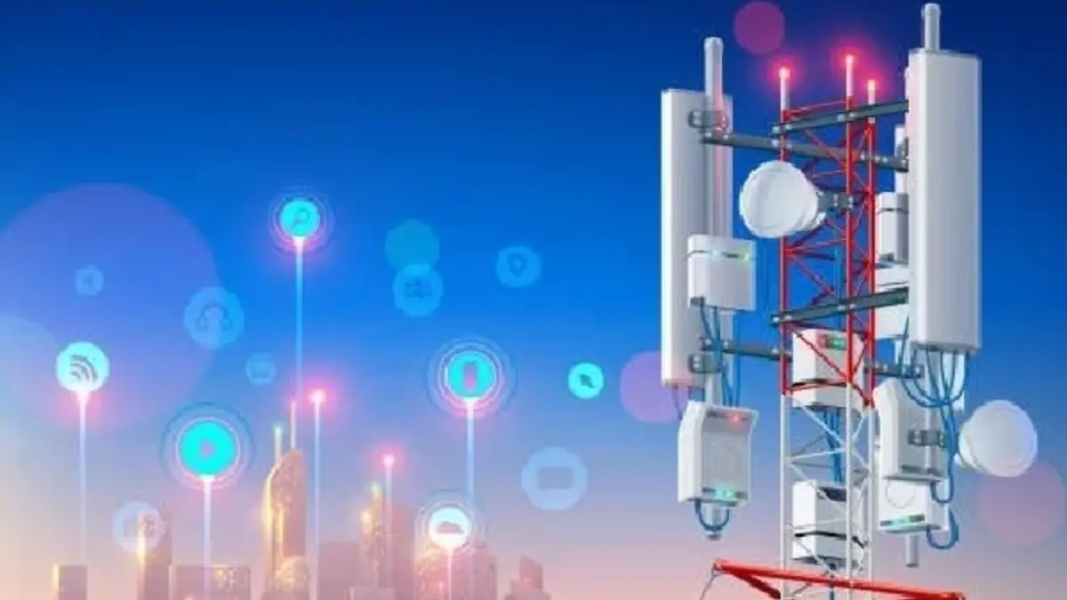a tower with many antennas and lights- New Telecom Act