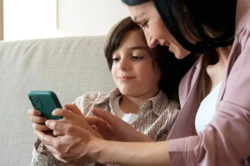 Parental Consent for Kids Social Media | mother-son-looking-together-smartphone